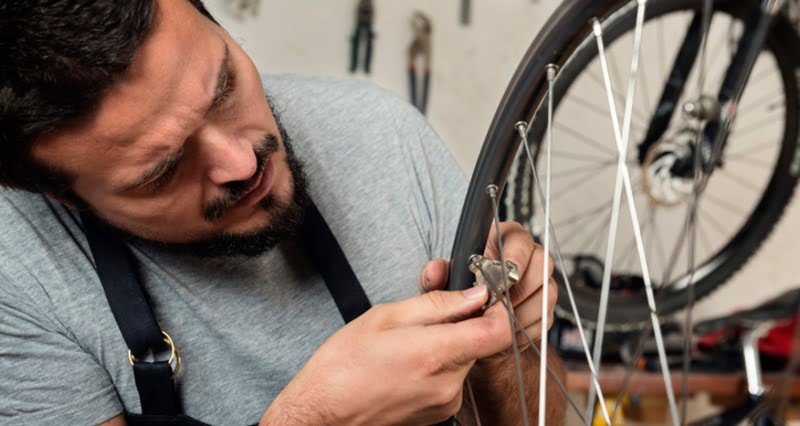 Checking bike spokes